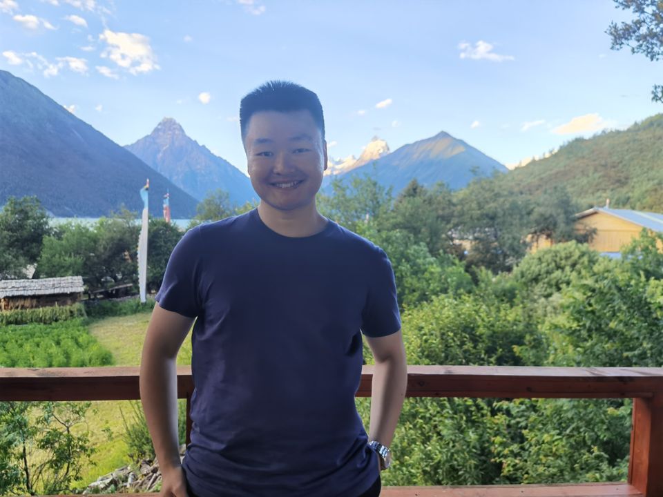 Standing in front of Tibetan mountains